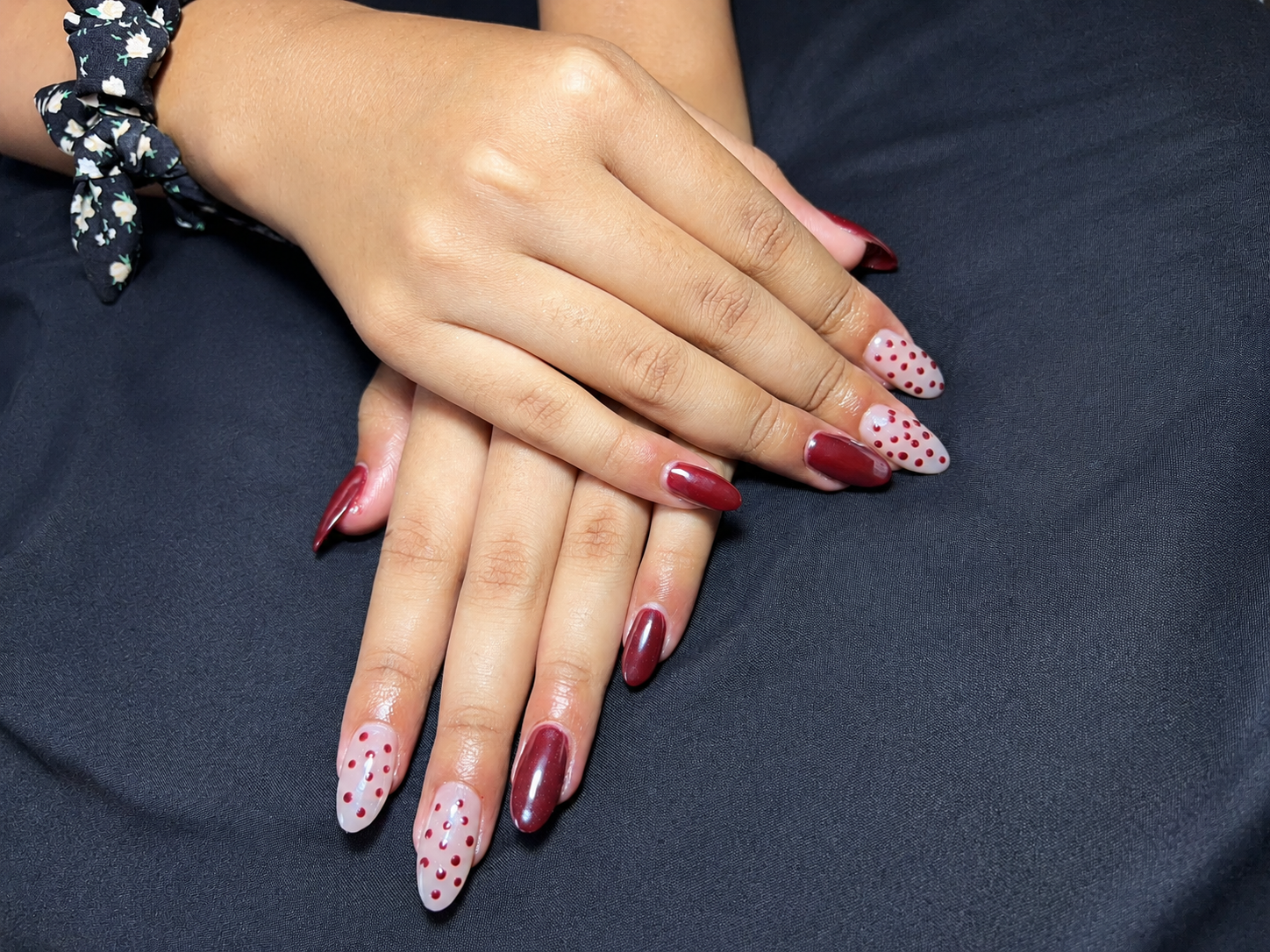 Burgundy almond gel with polka-dot accent