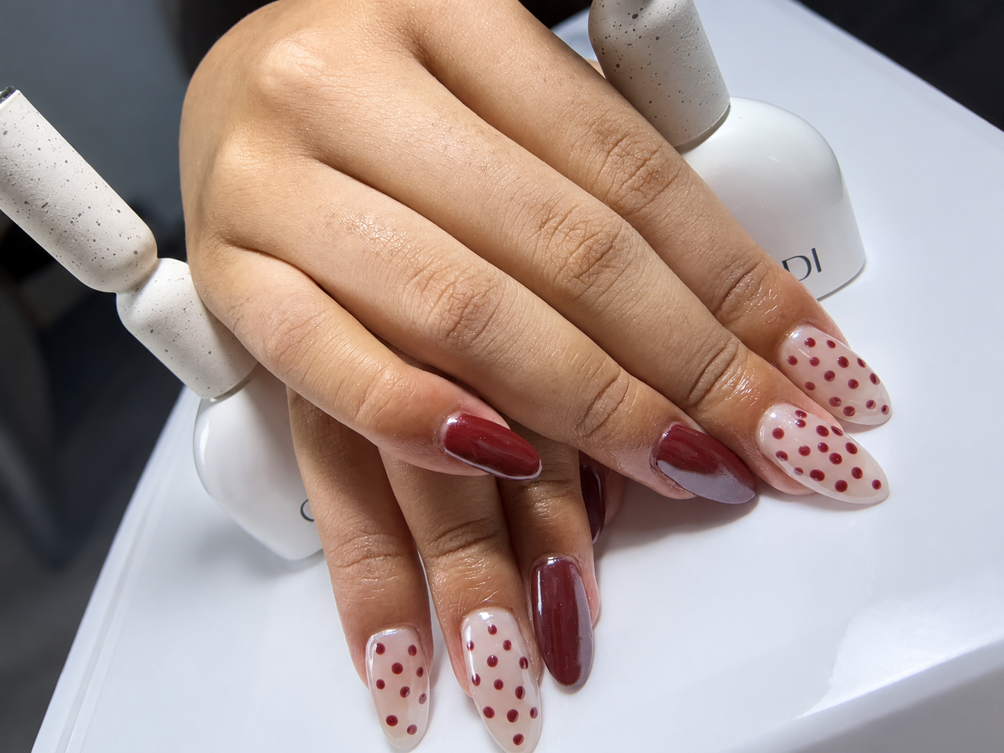 Red gel with dotted accent nails